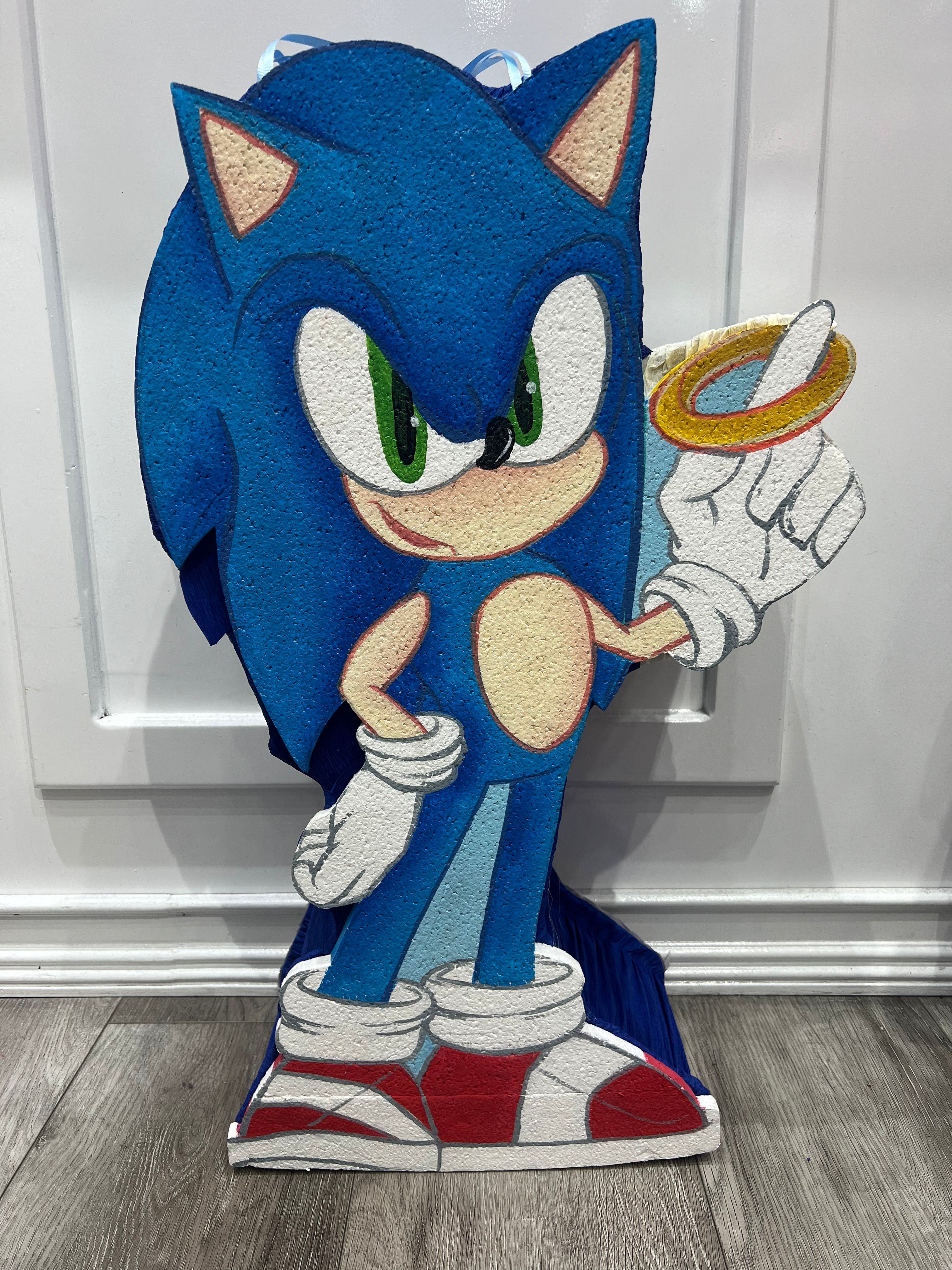 Sonic Piñata holding ring