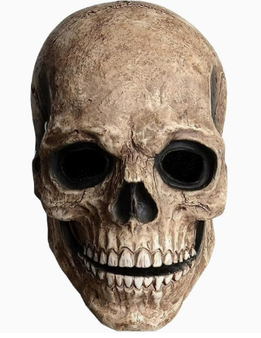 Tan and brown weathered skull mask with dark eye sockets, sculpted cheekbones and exposed teeth.