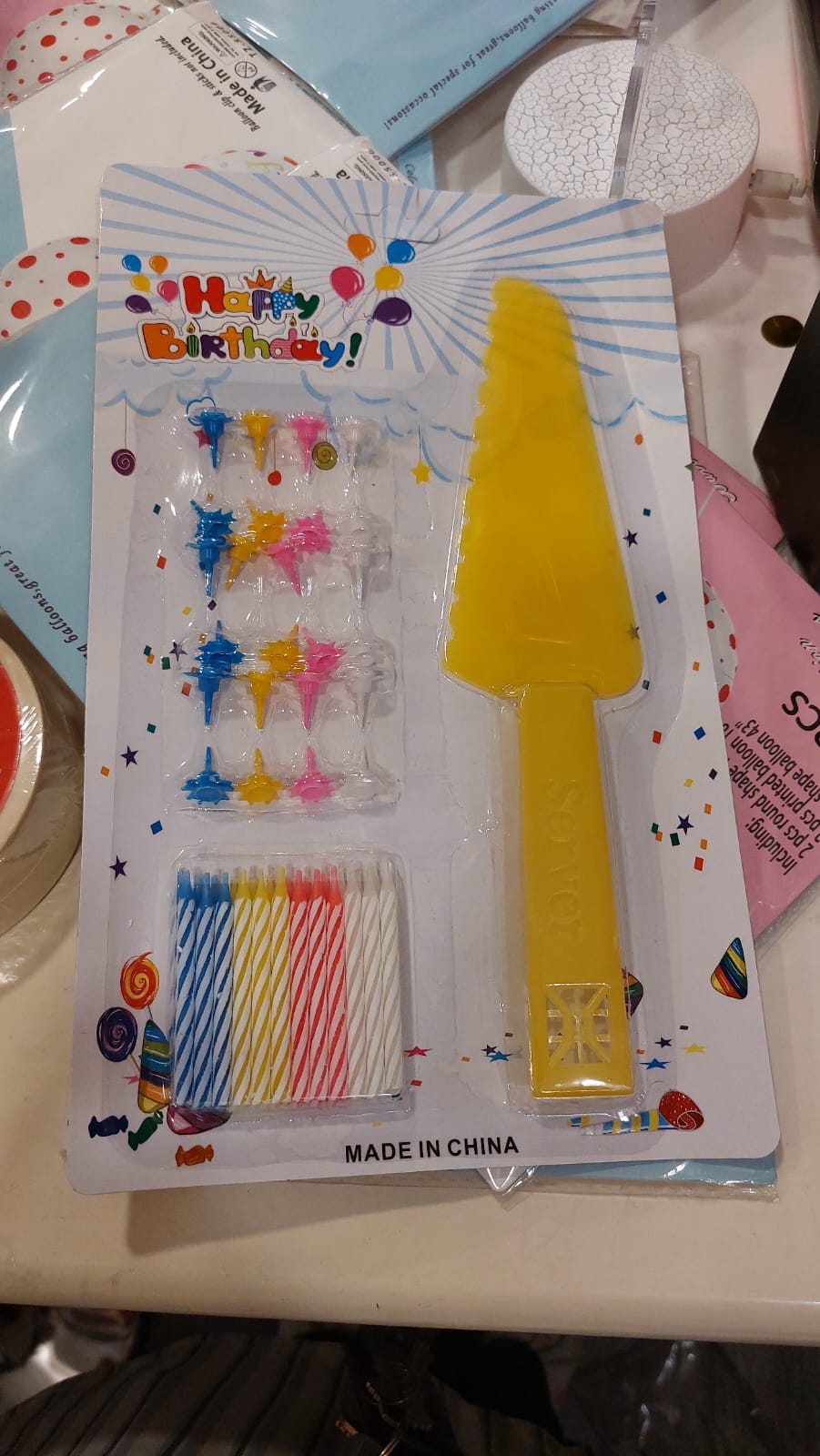 Yellow Happy Birthday candles with cake spatula