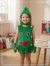 Child wearing a green vegetable costume with a smiling face and matching pointed headpiece