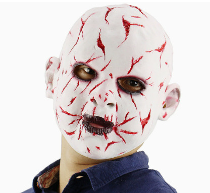White bald horror mask with red slash marks, dark eye accents and black stitched-mouth detailing.